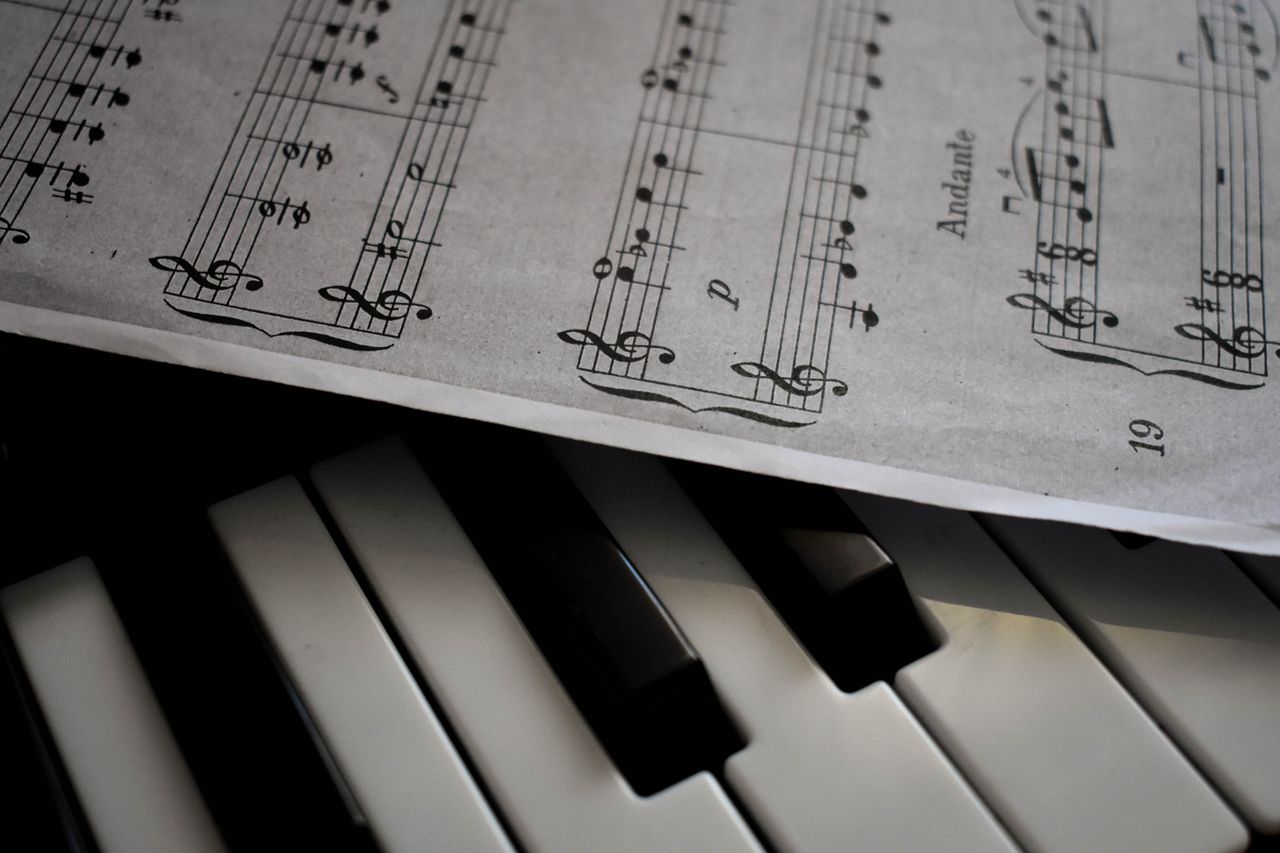 Mastering the First Impression: Your intriguing post title goes here A detailed view of piano keys alongside a sheet of musical notation, emphasizing harmony.